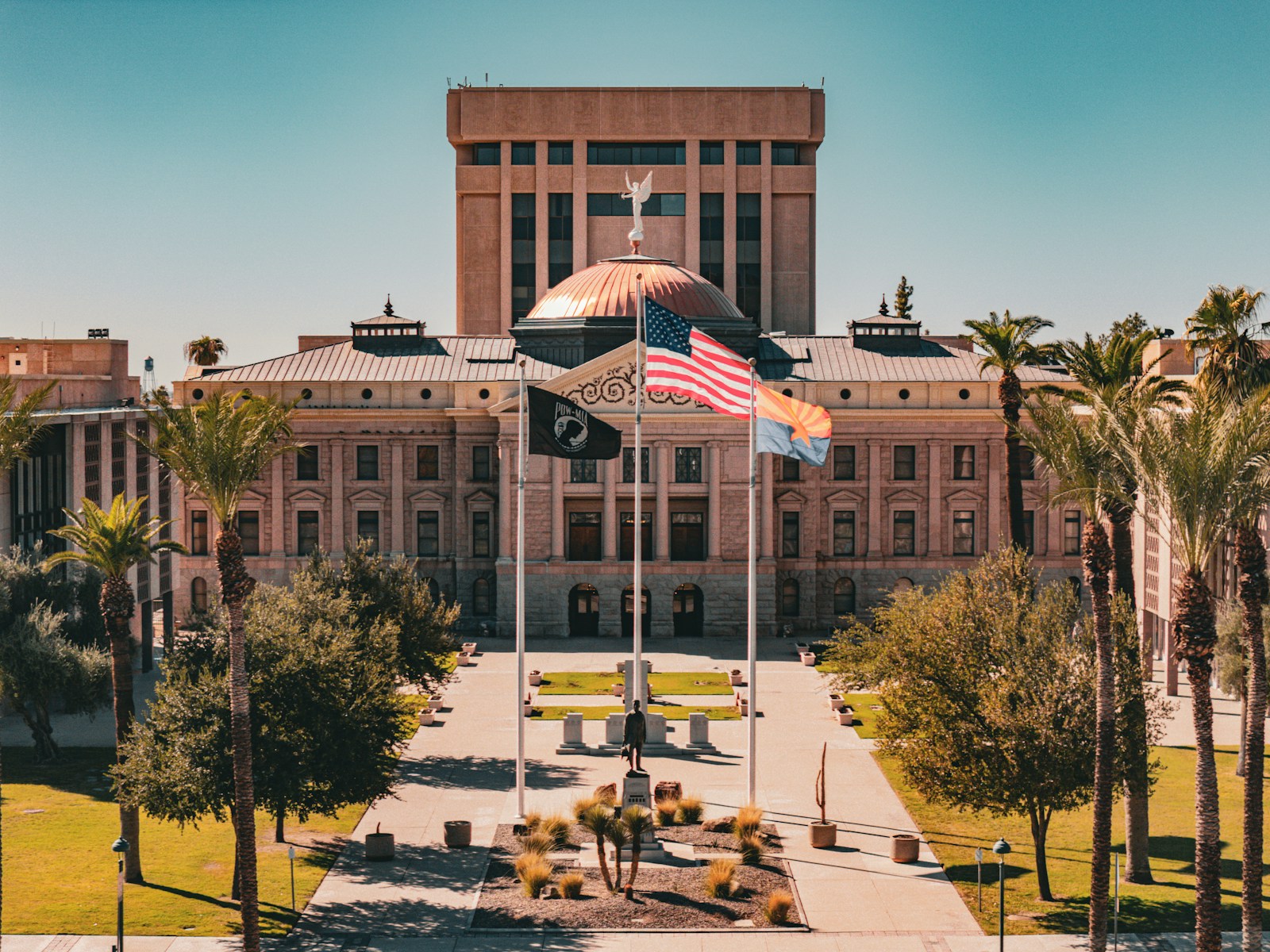A large building with a flag flying in front of it